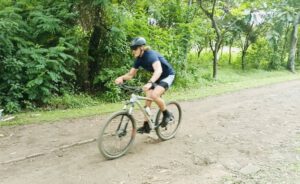 Elijah Wootton riding at the Kyaninga Triathlon 2024